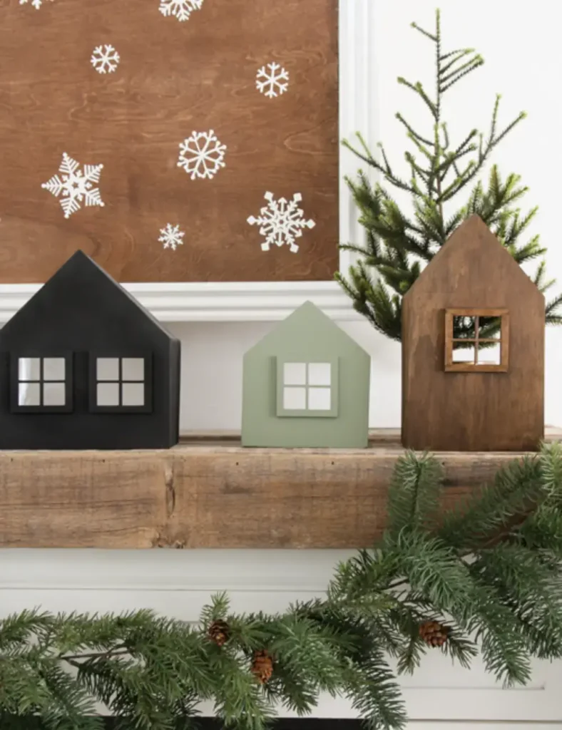 Stained-wooden-cottage-style-Christmas-village-houses-with-dollhouse-windows-displayed-on-a-mantel.